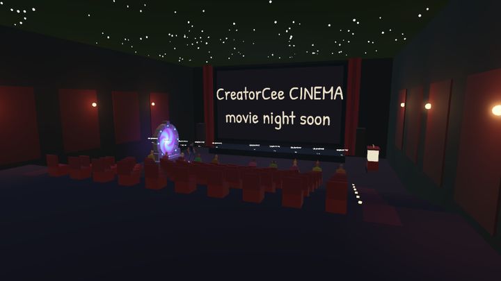 A dark cinema hall with a huge screen